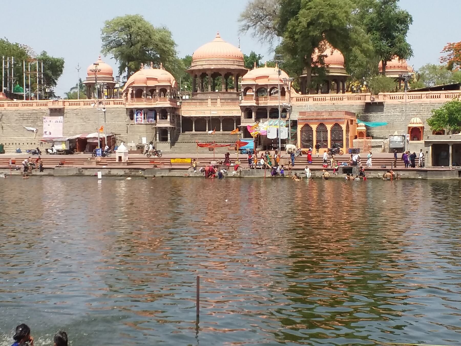 Stone ghats and domed pavilions along the bank of a wide river